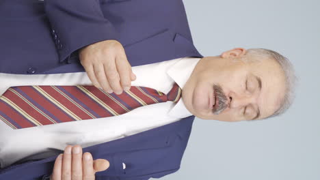 Vertical-video-of-Coughing-old-businessman.